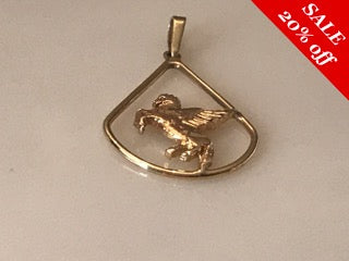 14 K.T. YELLOW GOLD LADIES CHARM W/ A PEGASIS HORSE AT CENTER