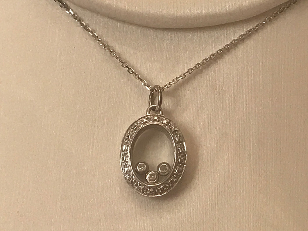 14 K.T. WHITE GOLD LADIES DIAMOND PENDANT OVAL SHAPED